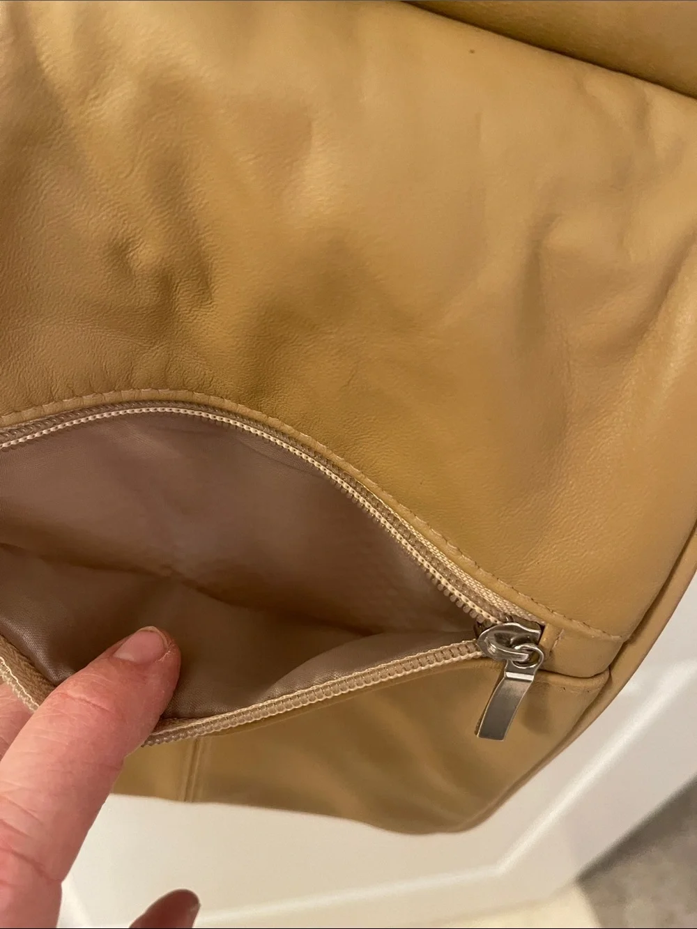 Buxton tan crossbody sling backpack